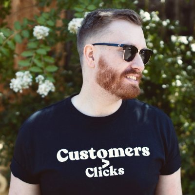Matt Lady outdoors, wearing sunglasses and a black T-shirt